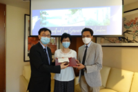 College Head Prof. Chan Sun On and Chairperson of the Staff Association Prof. Cheng Sze Lok Alfred presenting the Long Service Award to Dr. Lam Ka Ka.